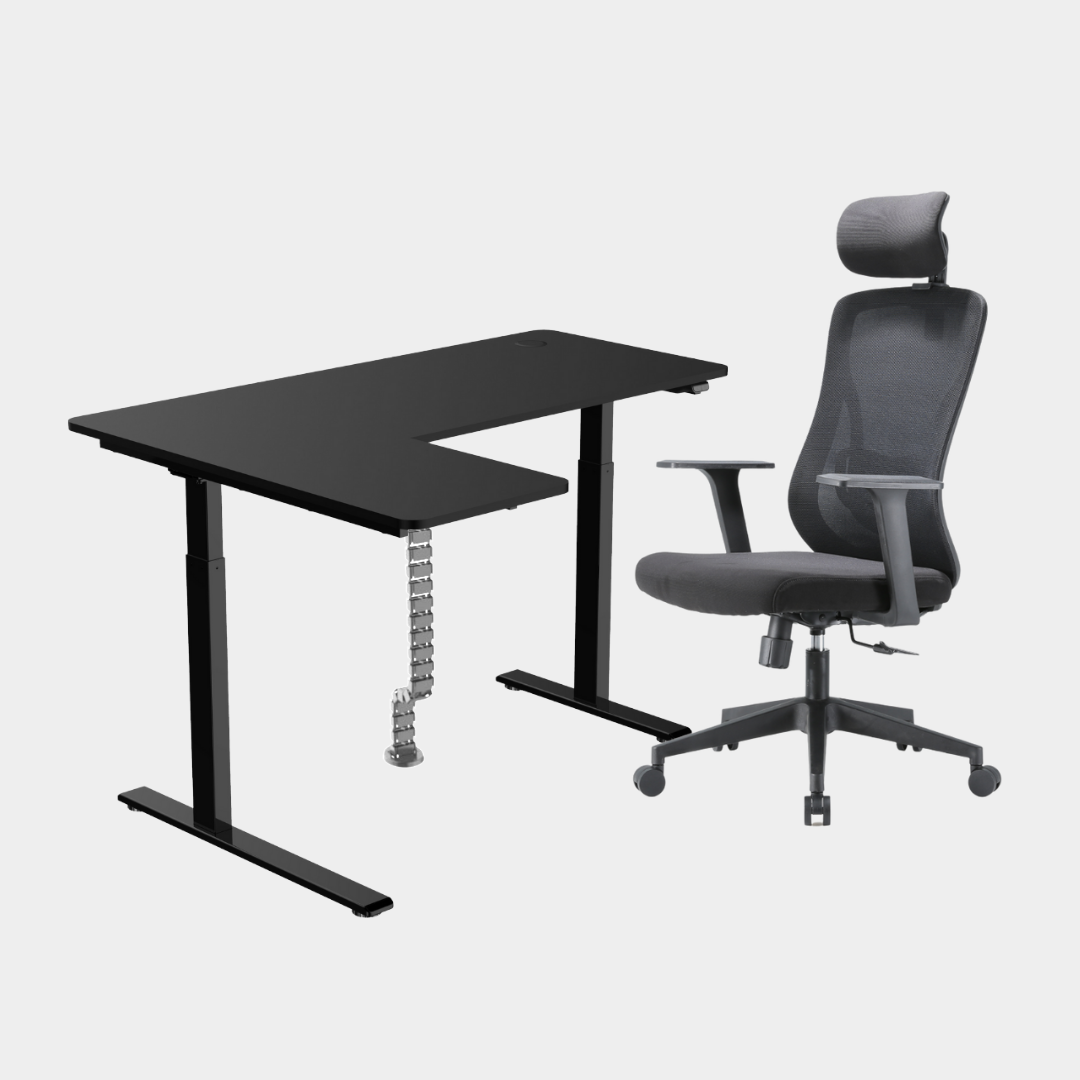 An L-shaped height-adjustable desk with a black tabletop and black legs, with grey cable management and chair viewed from a front angle against a white background.