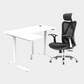 An L-shaped height-adjustable desk with a white tabletop and white legs, with grey cable management and chair viewed from a front angle against a white background.